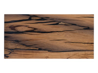 Embrace the Rugged Beauty: A Bog Oak coffee table, top view. Uncover the unique patterns and weathered character of the Bog Oak wood, embodying rustic elegance.