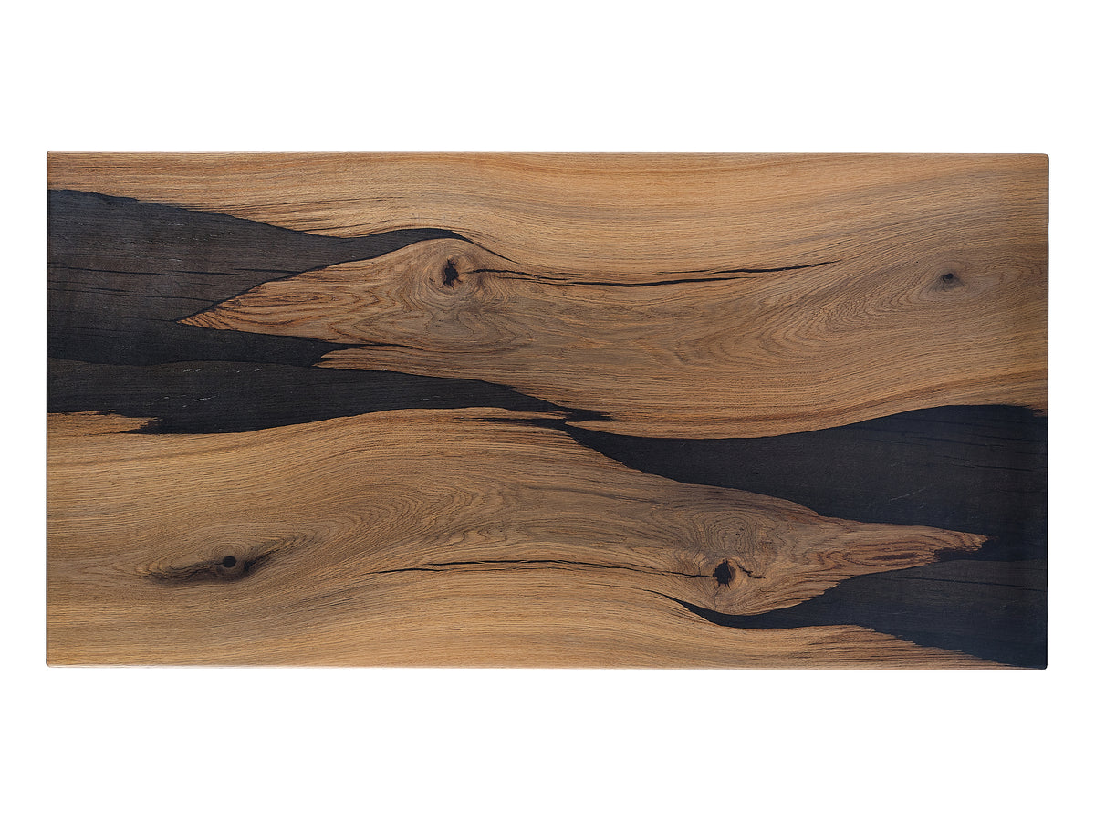 The 'Two Birds in Harmony' Bog Oak coffee table showcases a carved design of two birds, crafted from light and dark Bog Oak wood. Top view.